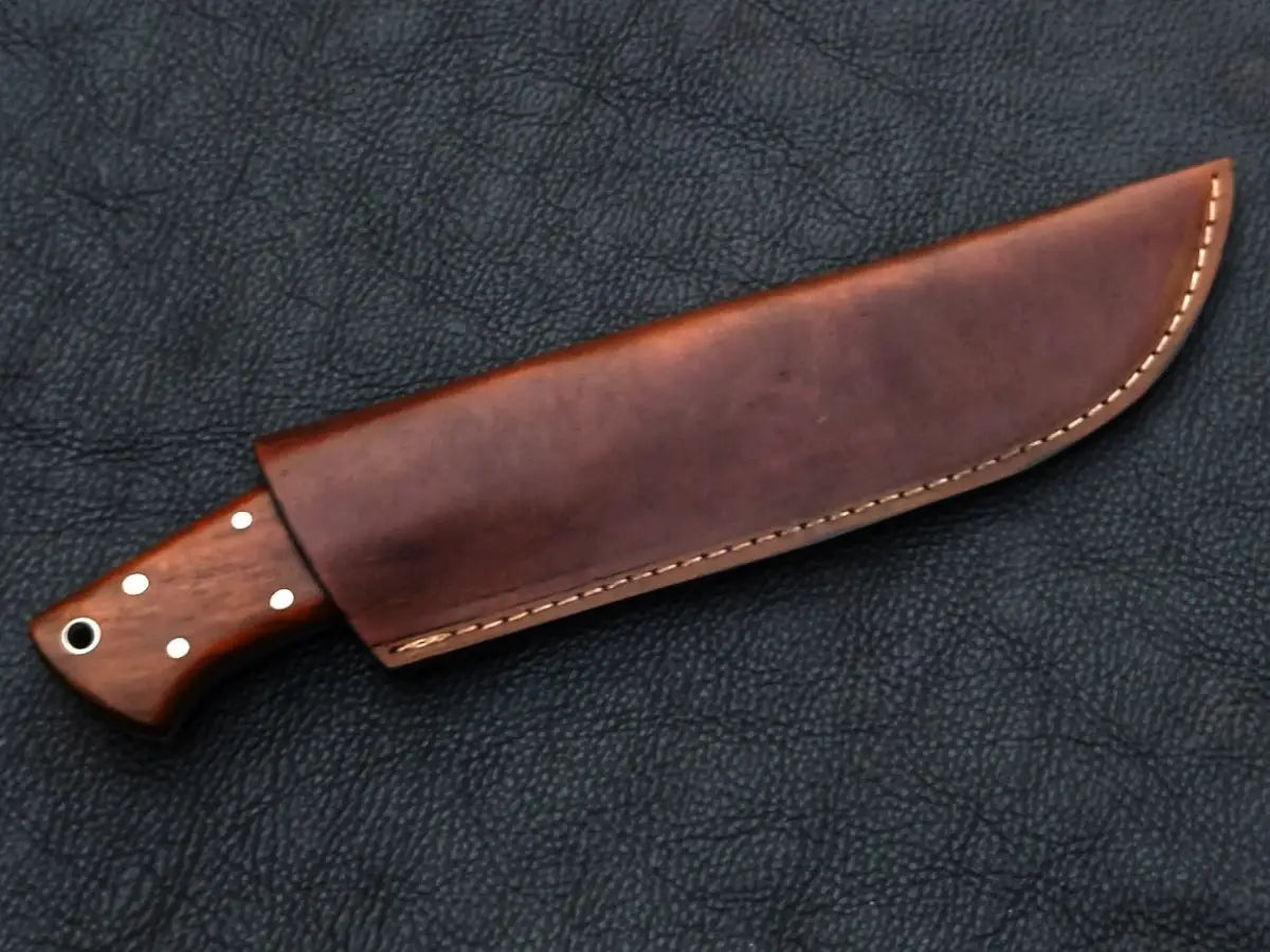 Brown-handled knife in leather sheath, showcasing Handmade Damascus Steel craftsmanship
