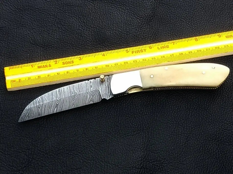 Handmade Damascus Steel Folding Knife with Bone Handle for collectors and enthusiasts