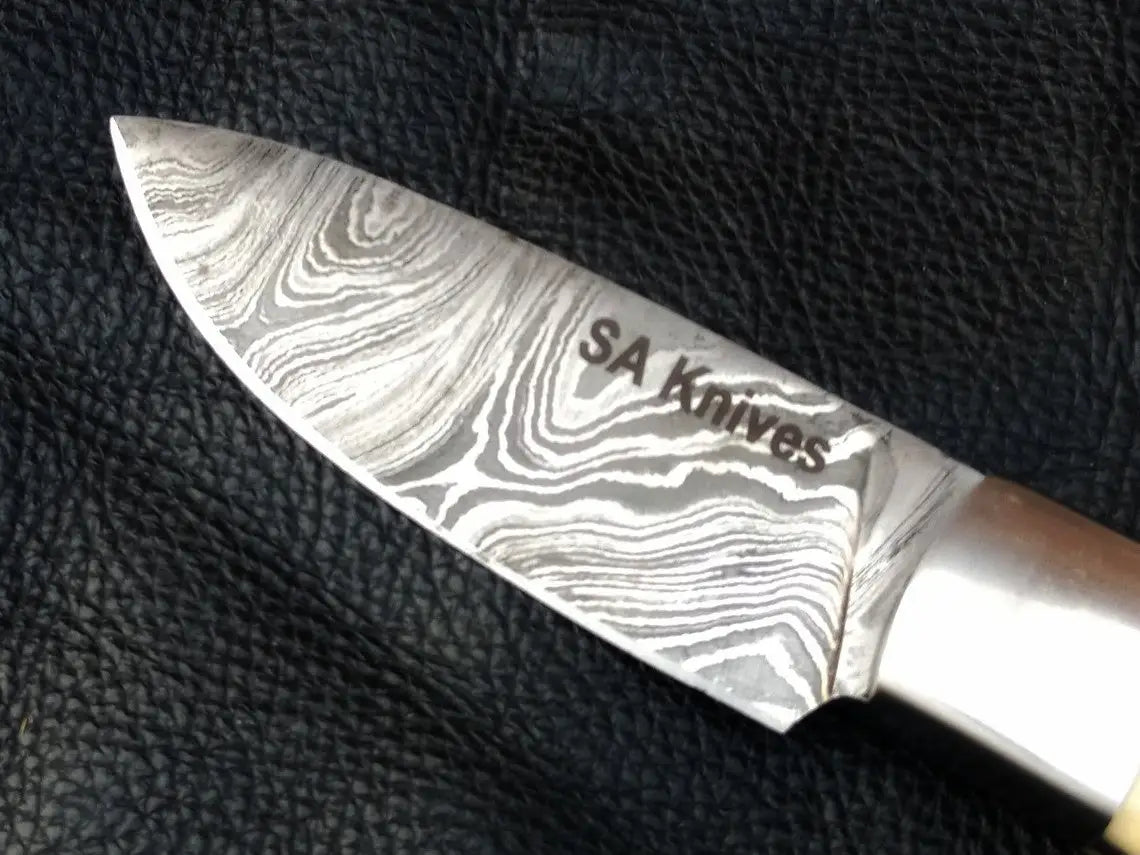 Camel Bone Skinning Knife SAK004 featuring a Damascus steel blade for ultimate precision