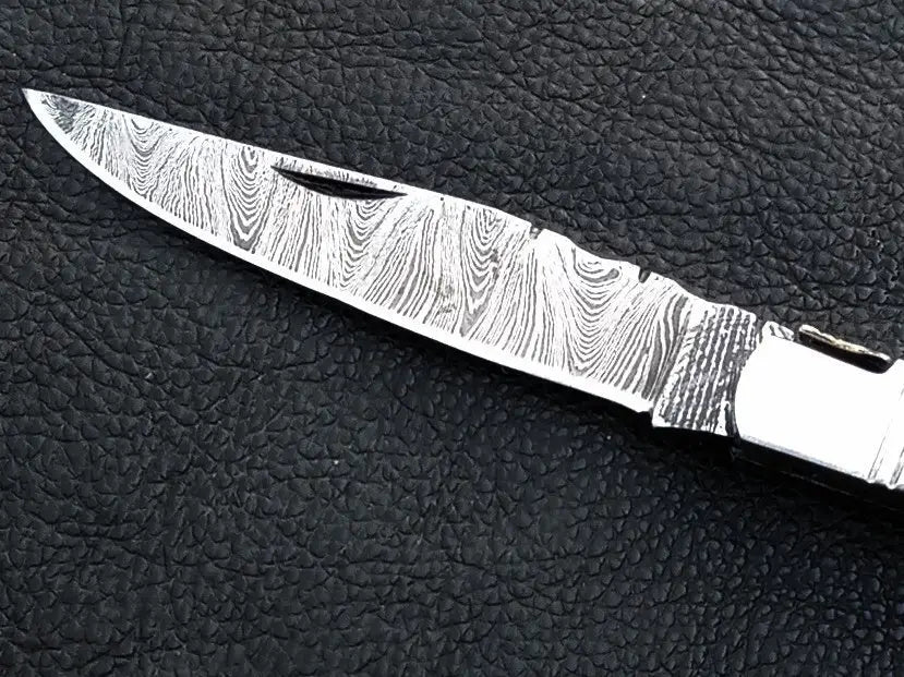 Handmade Damascus Steel Folding Knife - C161 showcasing elegant craftsmanship and design