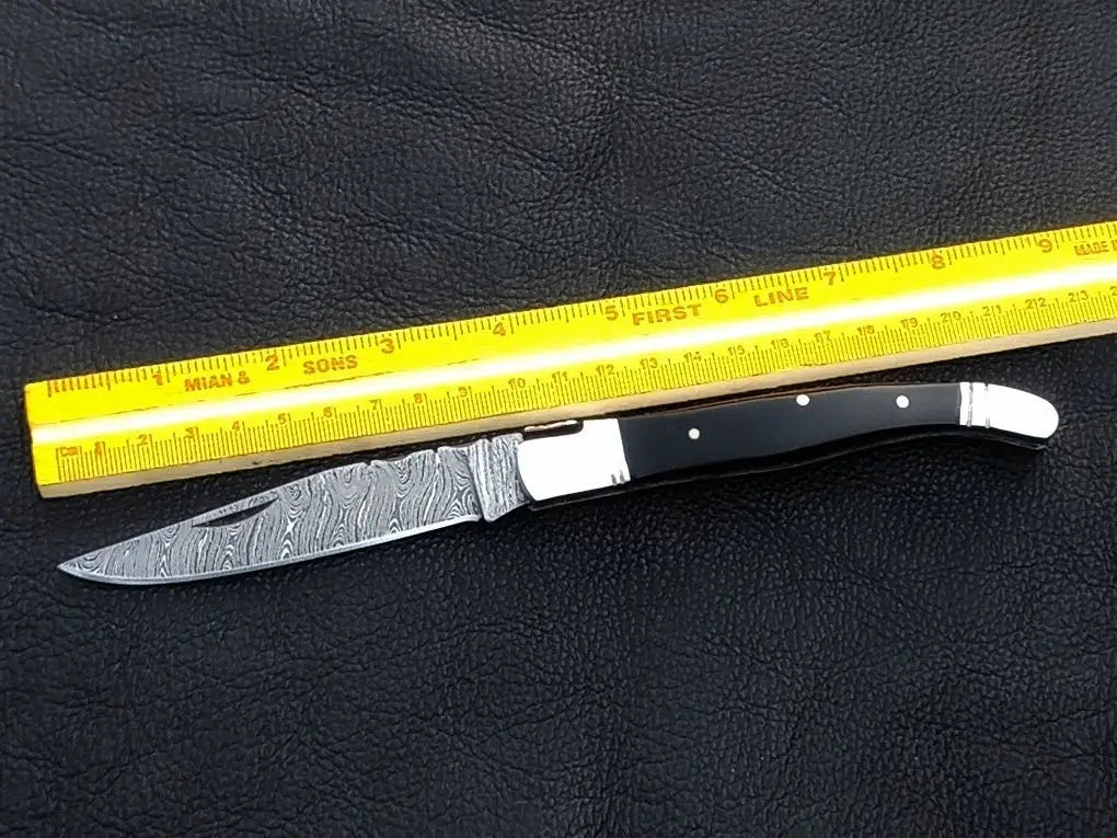 Handmade Damascus Steel Folding Knife - C162 showcasing intricate blade patterns