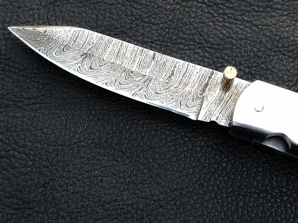 Handmade Damascus Steel Folding Knife - C171 with intricate blade design and craftsmanship