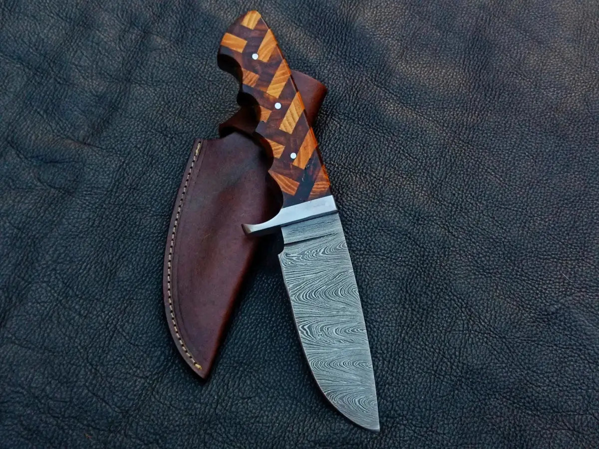 Handmade Damascus Steel Hunting Knife with patterned wooden handle and leather sheath