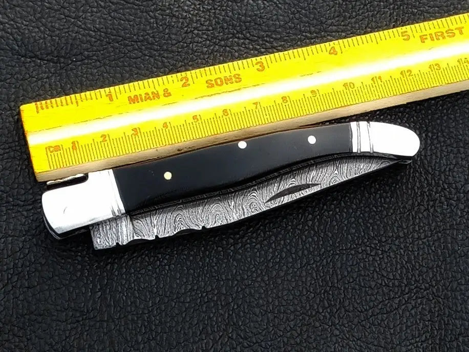 Handmade Damascus Steel Folding Knife C162 with intricate blade design and craftsmanship