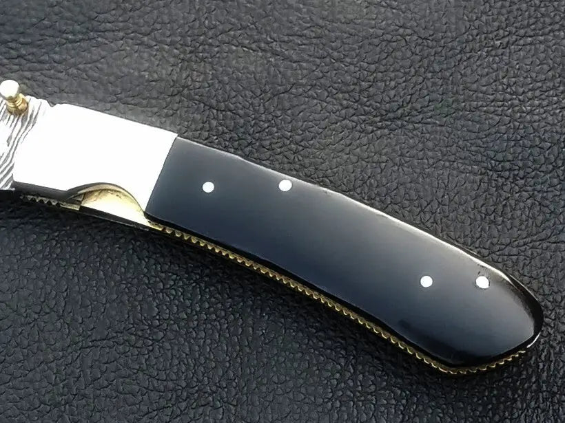 Black-handled folding knife from Handmade Damascus Steel Folding Knife - C168