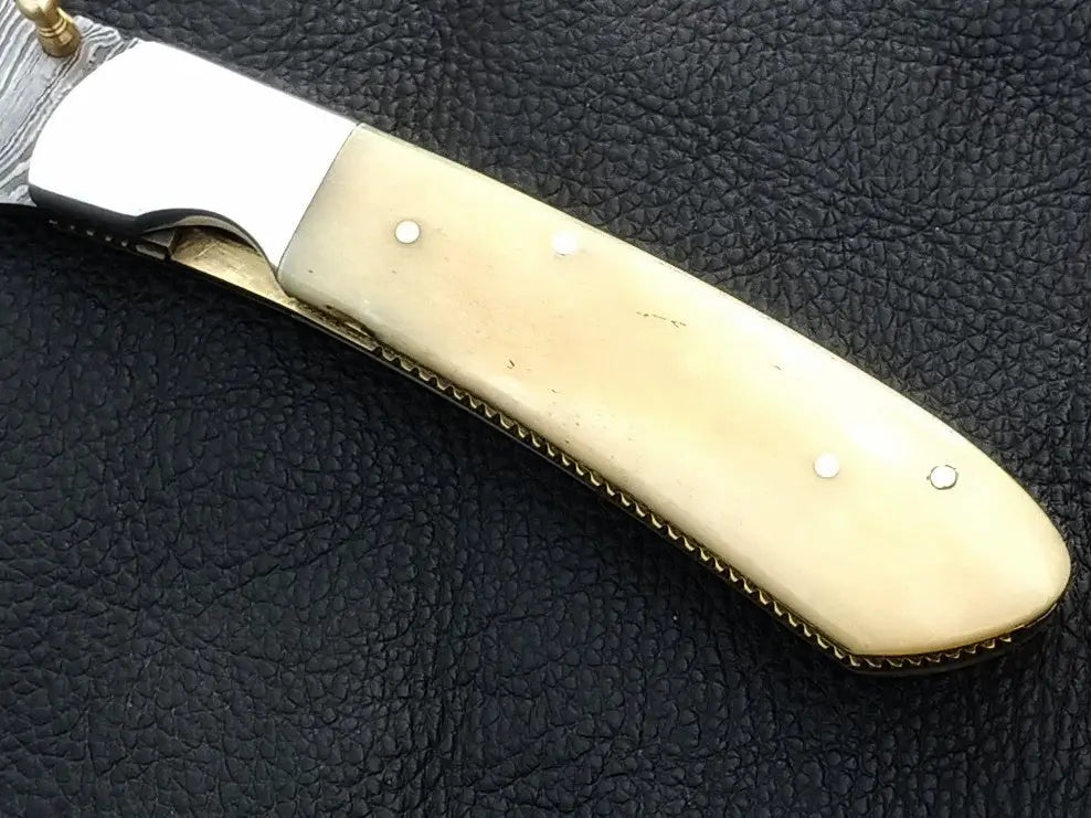 Handmade Damascus Steel Folding Knife with elegant bone handle design