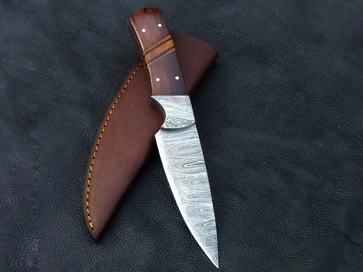 Damascus Steel Hunting Knife-C104 with leather sheath showcasing intricate blade design