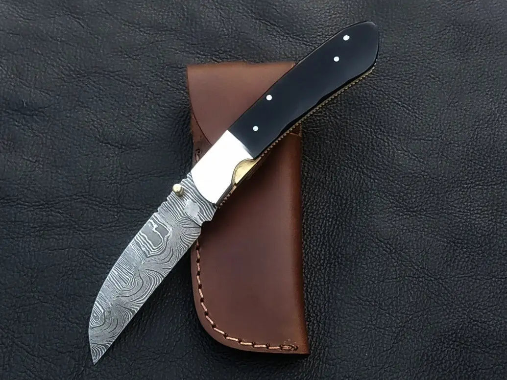 Handmade Damascus Steel Folding Knife C168 with intricate blade patterns and craftsmanship
