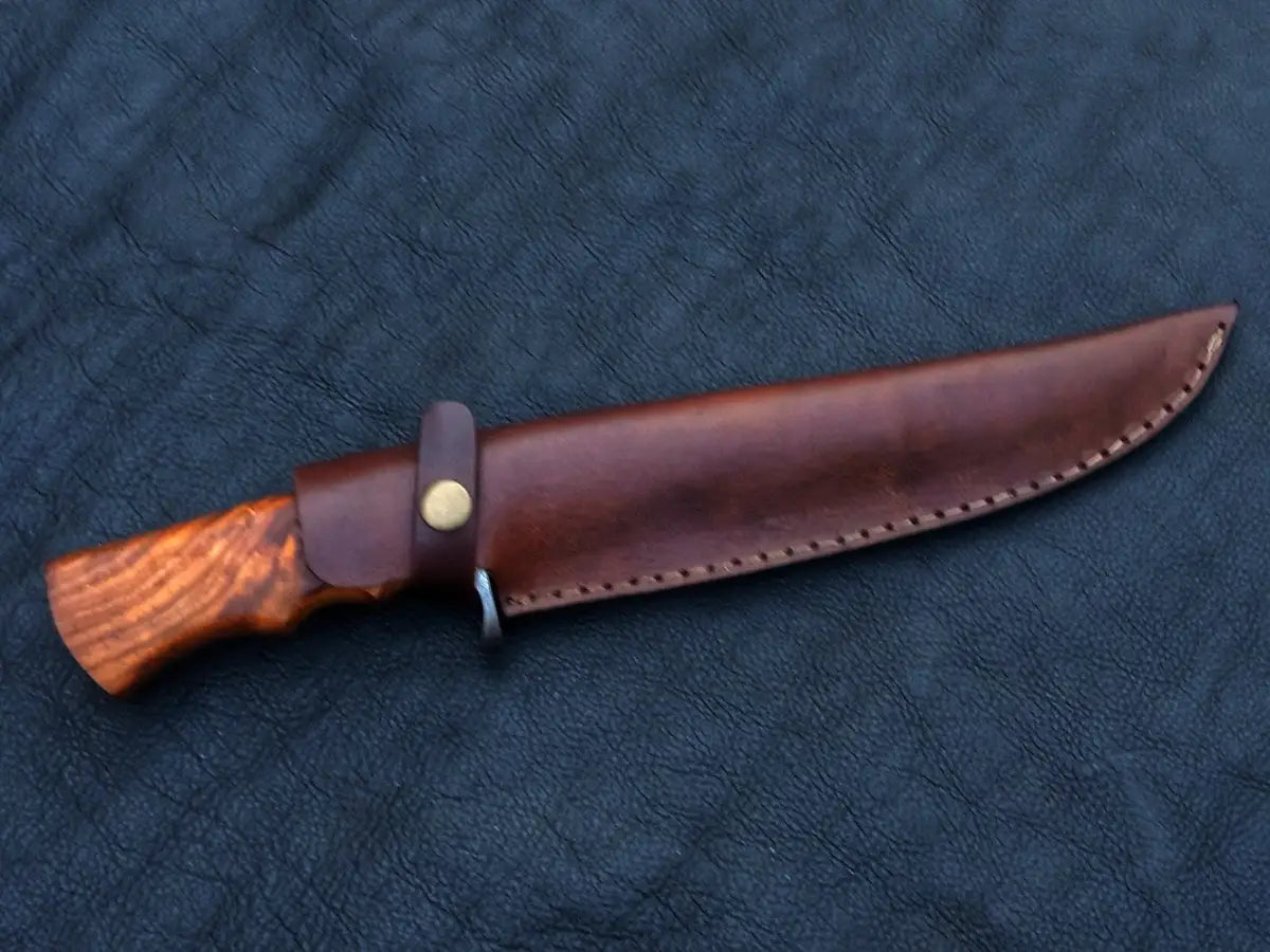 Hunting knife in leather sheath featuring Handmade Damascus Steel Bowie C147 design