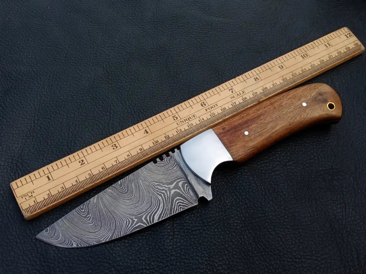 Handmade Damascus Steel Skinning Knife-C26 with knife and ruler on a table