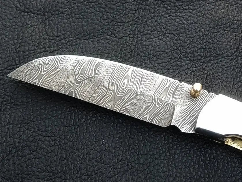 Handmade Damascus Steel Folding Knife - C164 showcasing intricate craftsmanship and design