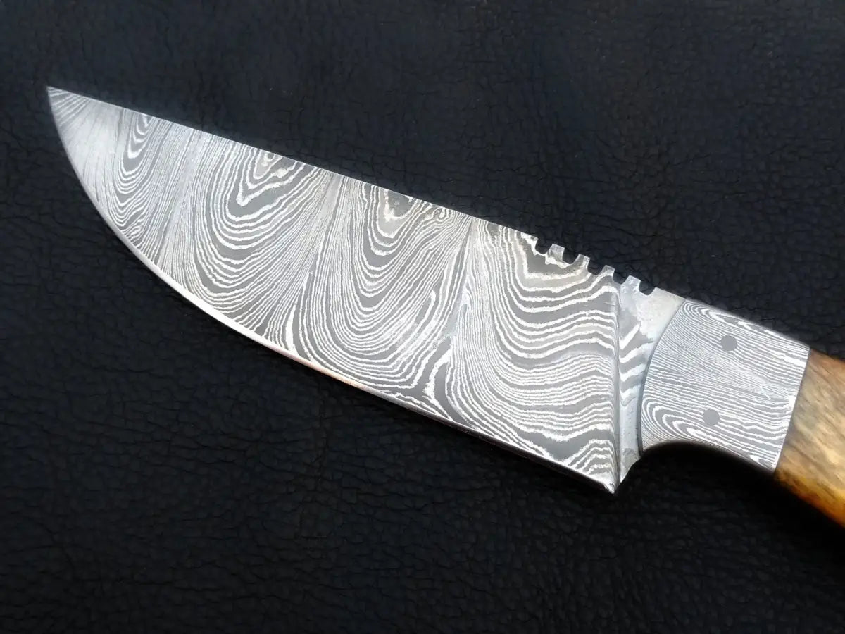 Handmade Damascus Steel Hunting Knife-C29 on black background.