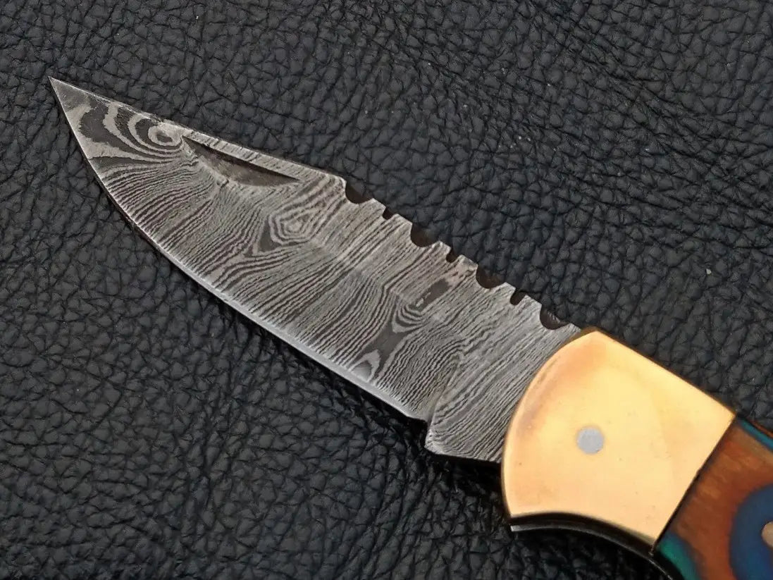 Handmade Damascus Steel Folding Knife SAF002 with intricate blade design and craftsmanship