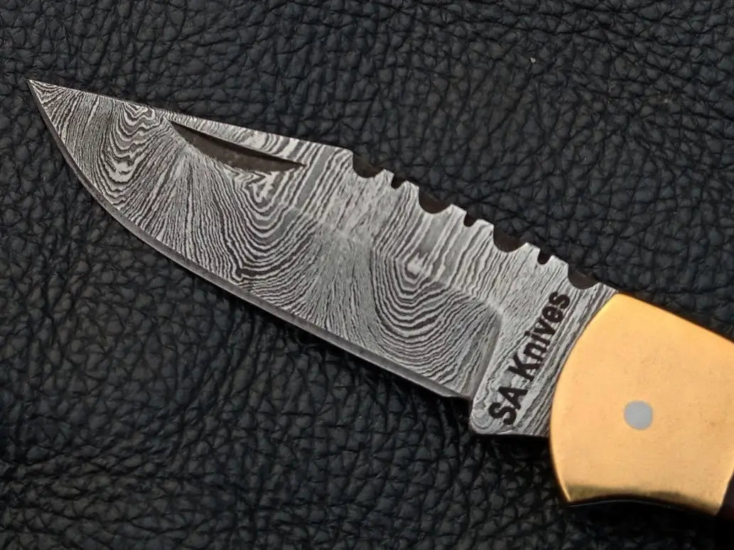 Handmade Damascus Steel Folding Knife SAF003 with intricate blade design and craftsmanship