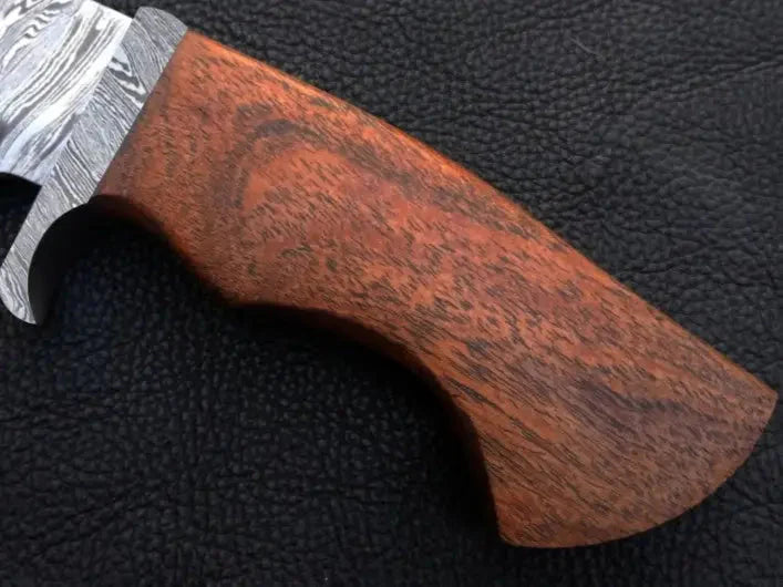 Handmade Damascus Steel Hunting Knife with a wooden handle for outdoor adventures
