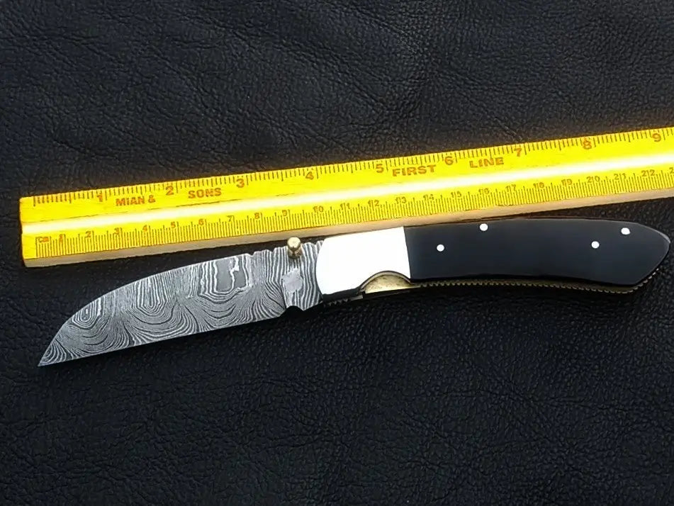 Handmade Damascus Steel Folding Knife - C168 showcasing intricate design and craftsmanship