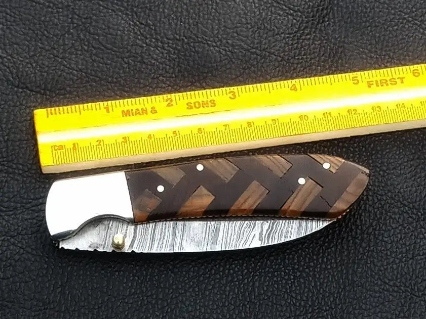 Handmade Damascus Steel Folding Knife - C167 showcasing intricate blade patterns