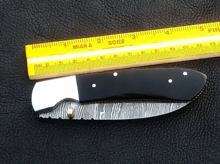 Handmade Damascus Steel Folding Knife - C168 showcasing intricate blade patterns