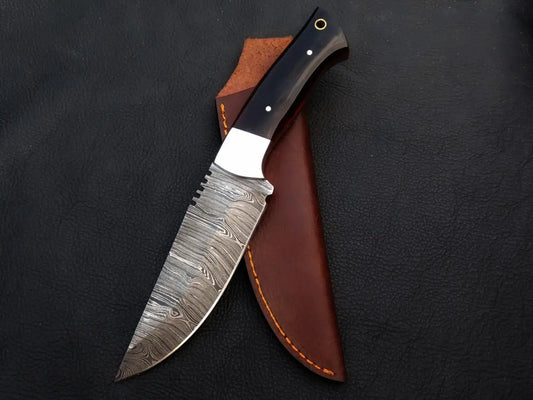Handmade Damascus steel hunting knife in leather sheath