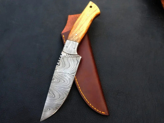 Handmade Damascus Steel Hunting Knife-C29 on black surface.