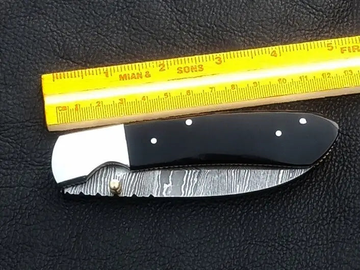 Handmade Damascus Steel Folding Knife - C168 showcasing intricate blade patterns