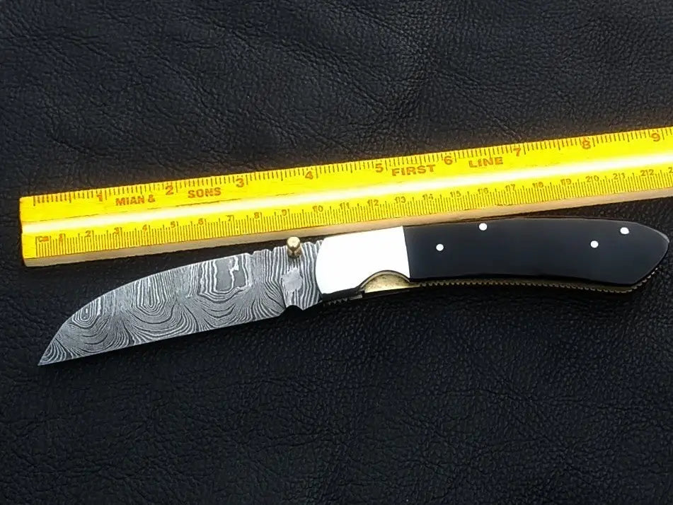 Handmade Damascus Steel Folding Knife - C168 showcasing intricate design and craftsmanship