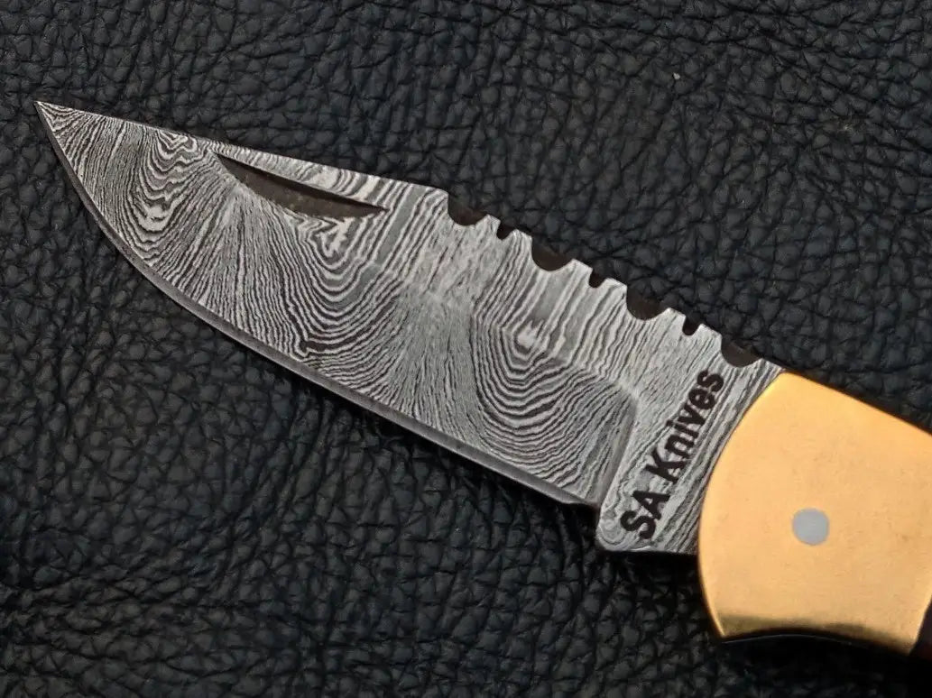 Handmade Damascus Steel Folding Knife SAF003 with intricate blade design and craftsmanship