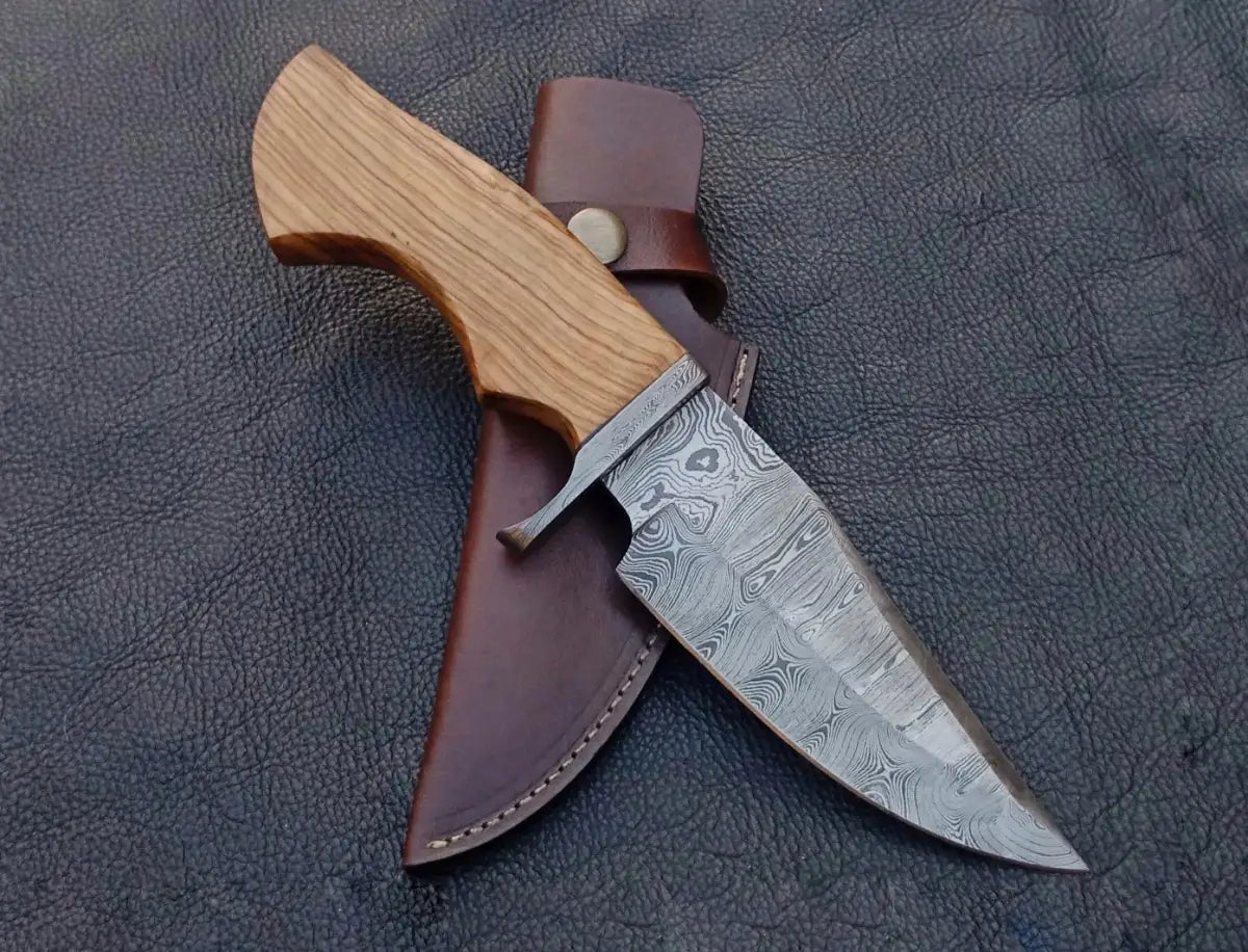 Damascus steel hunting knife with wooden handle and leather sheath for outdoor use