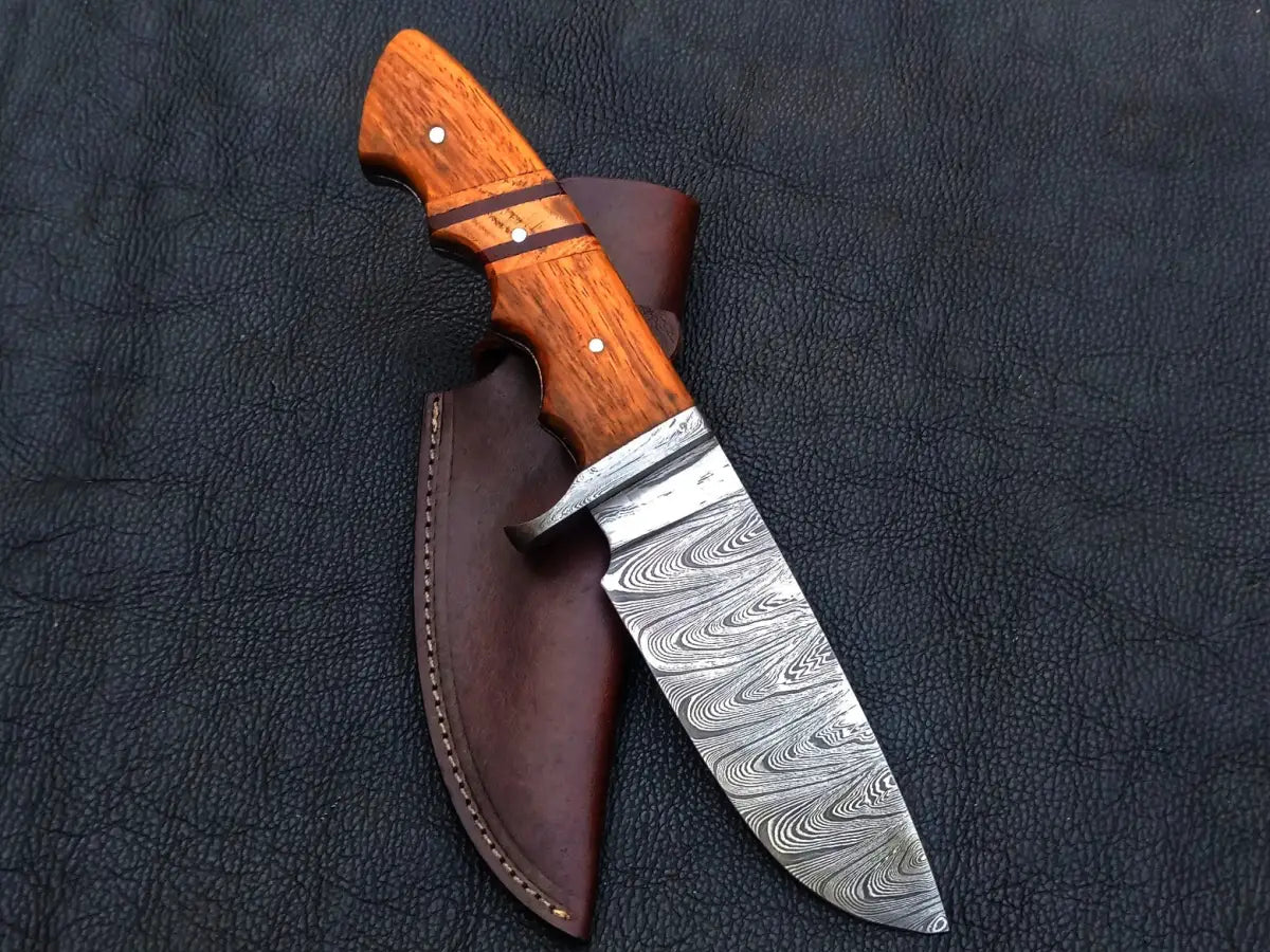 Handmade Damascus Steel Hunting Knife with a wooden handle, showcasing fine craftsmanship