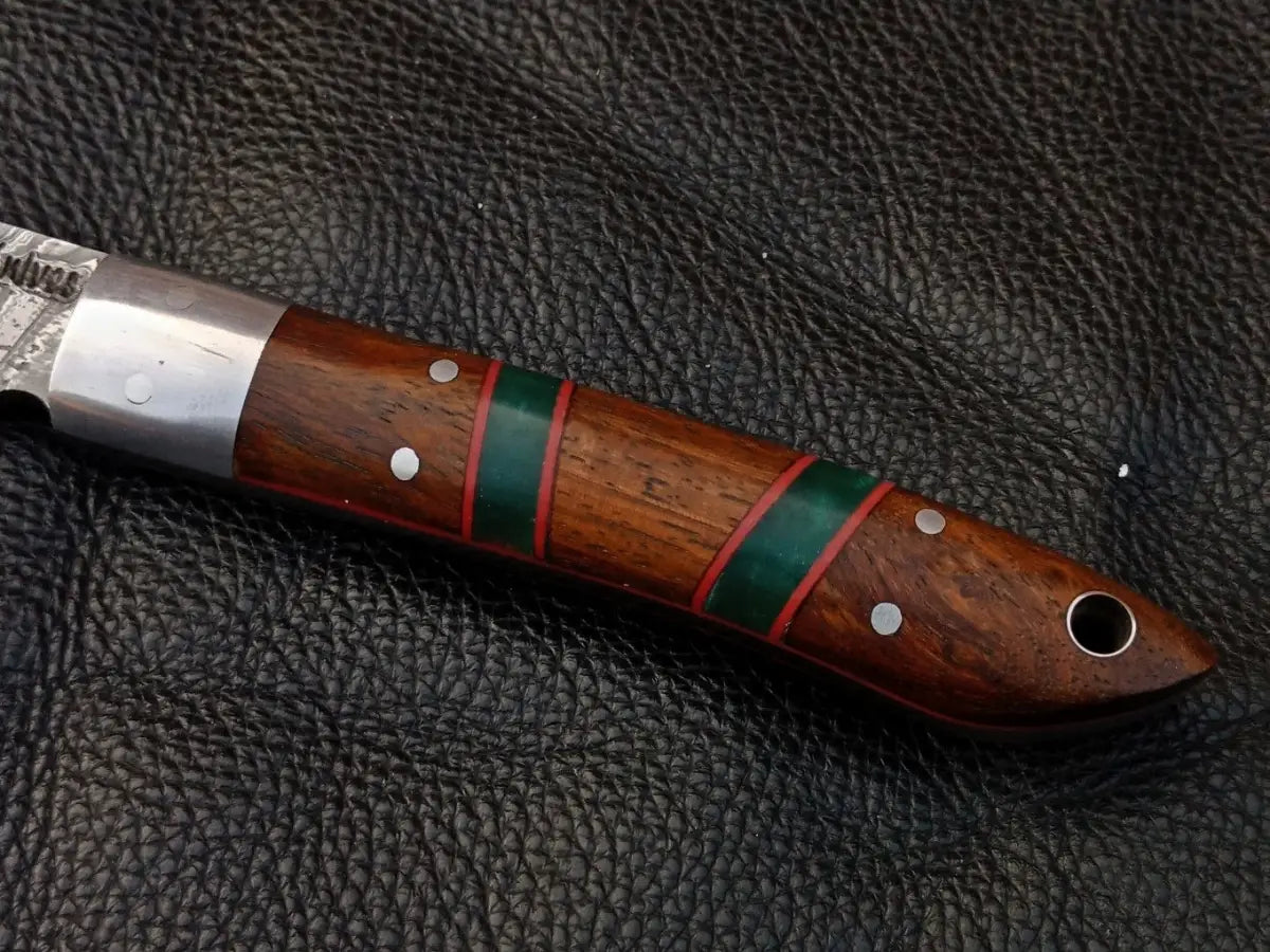Handcrafted wooden knife handle with green and red accents on Damascus Steel Bird Knife