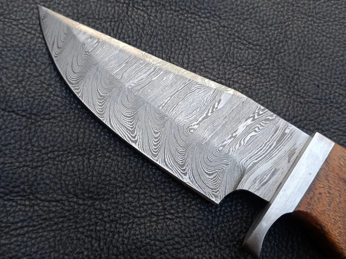 Handmade Damascus Steel Hunting Knife -C155 showcasing intricate blade patterns and craftsmanship