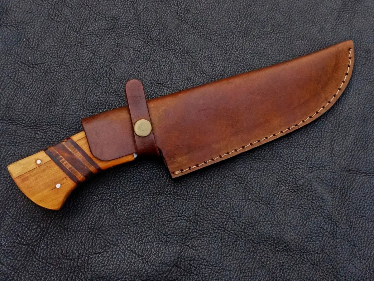 Handmade Damascus Steel Hunting Knife - C223 with a sheathed blade and intricate design