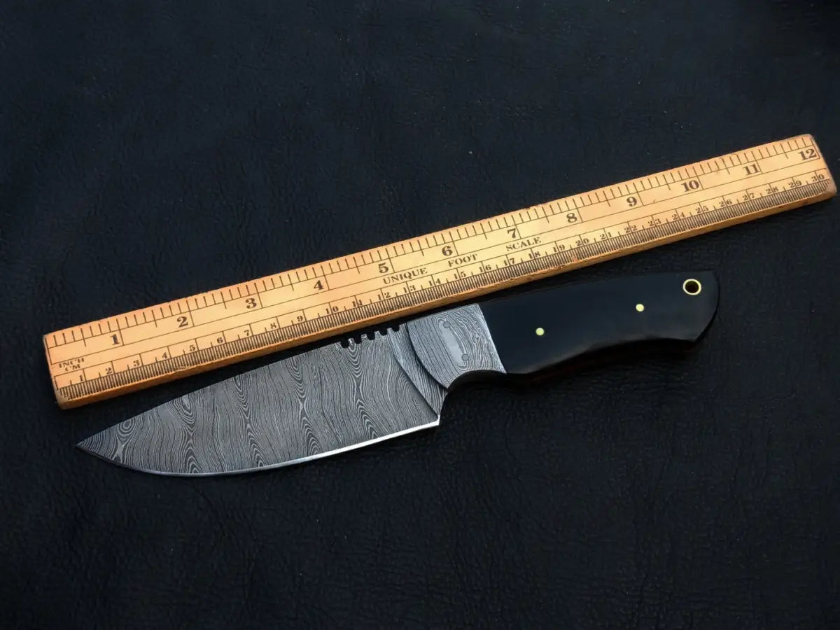 Handmade Damascus Steel Hunting Knife with a ruler on it