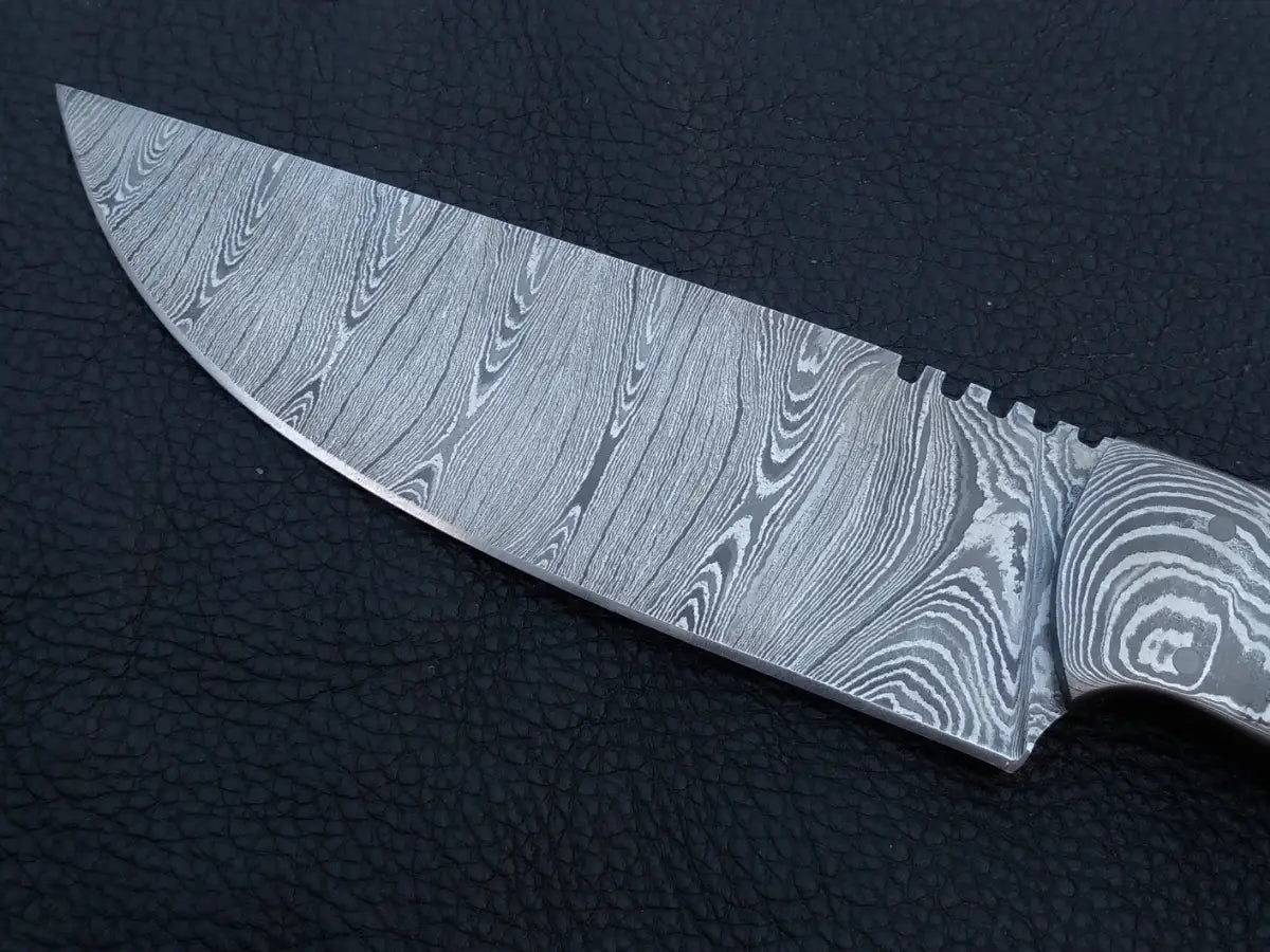 Handmade Damascus Steel Hunting Knife on Black Surface