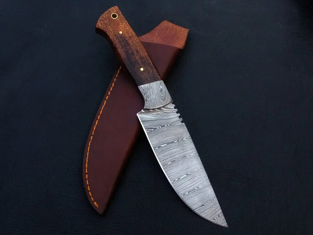 Handmade Damascus steel hunting knife in leather sheath