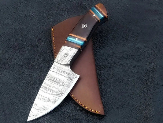 Damascus steel hunting knife with leather sheath.